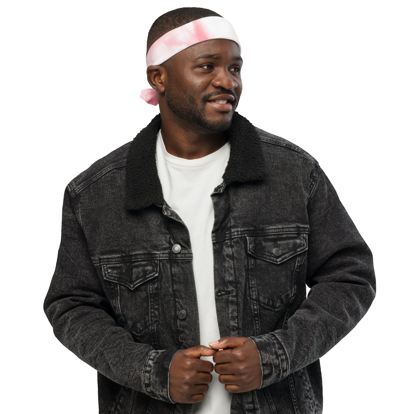 Man wearing a black denim jacket and white t-shirt with a pink headband on a white background