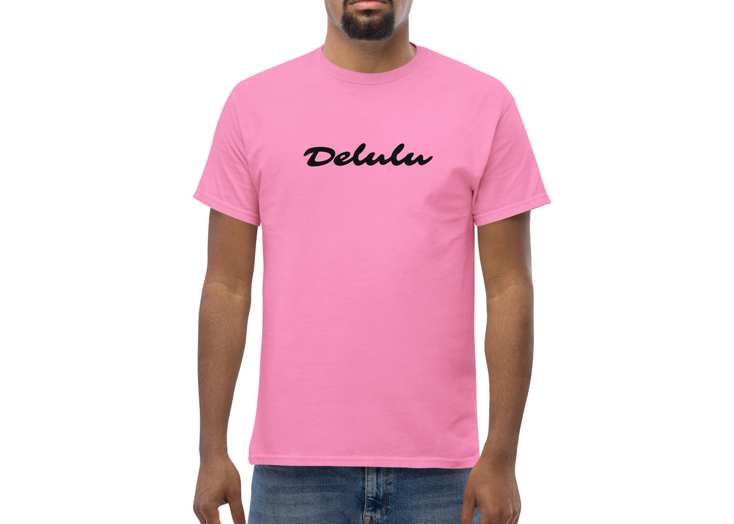 Man wearing a pink t-shirt with 'Delulu' logo on a white background