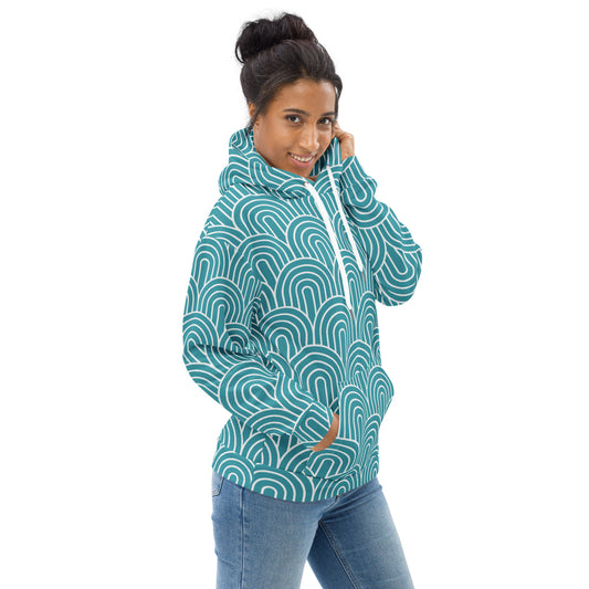 Woman wearing a teal patterned hoodie on a white background